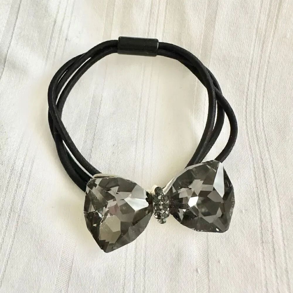 Chrome jeweled bow hair tie